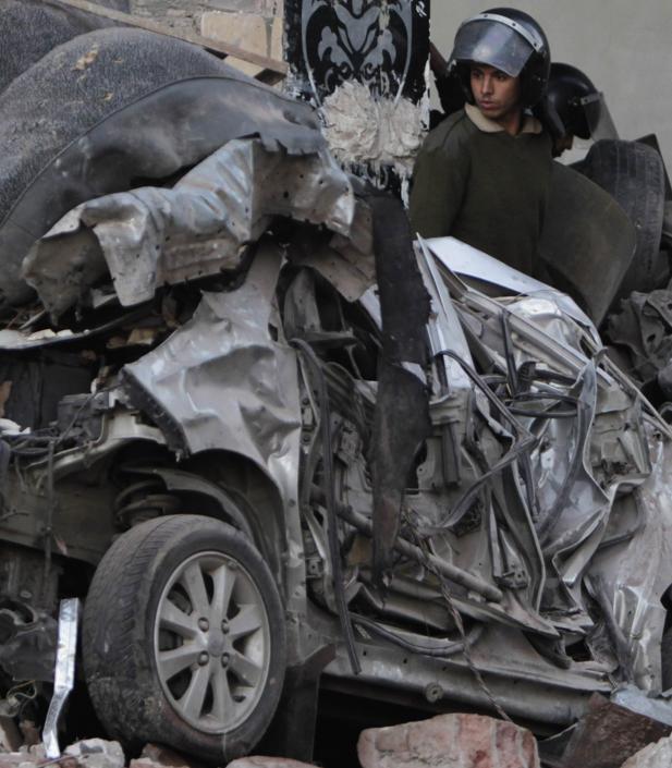 Damage cars are seen after an explosion in Egypt's Nile Delta town of Dakahlyia